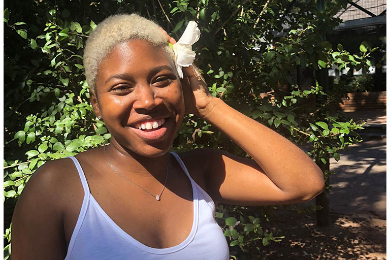 Victoria Jones poses with a white flower in her hair during a travel abroad experience.